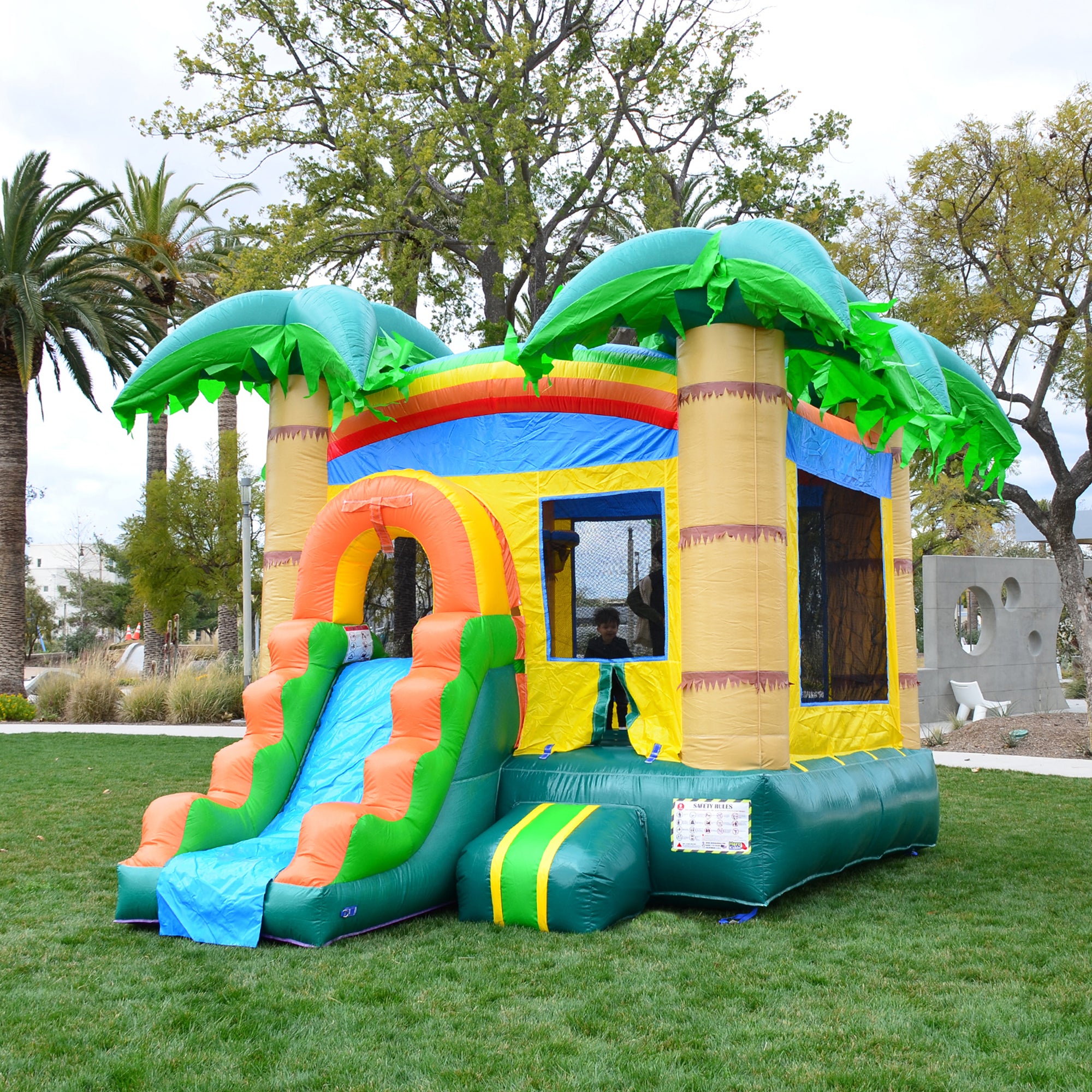 cheap bounce house inflatables with slide tropical design with trees