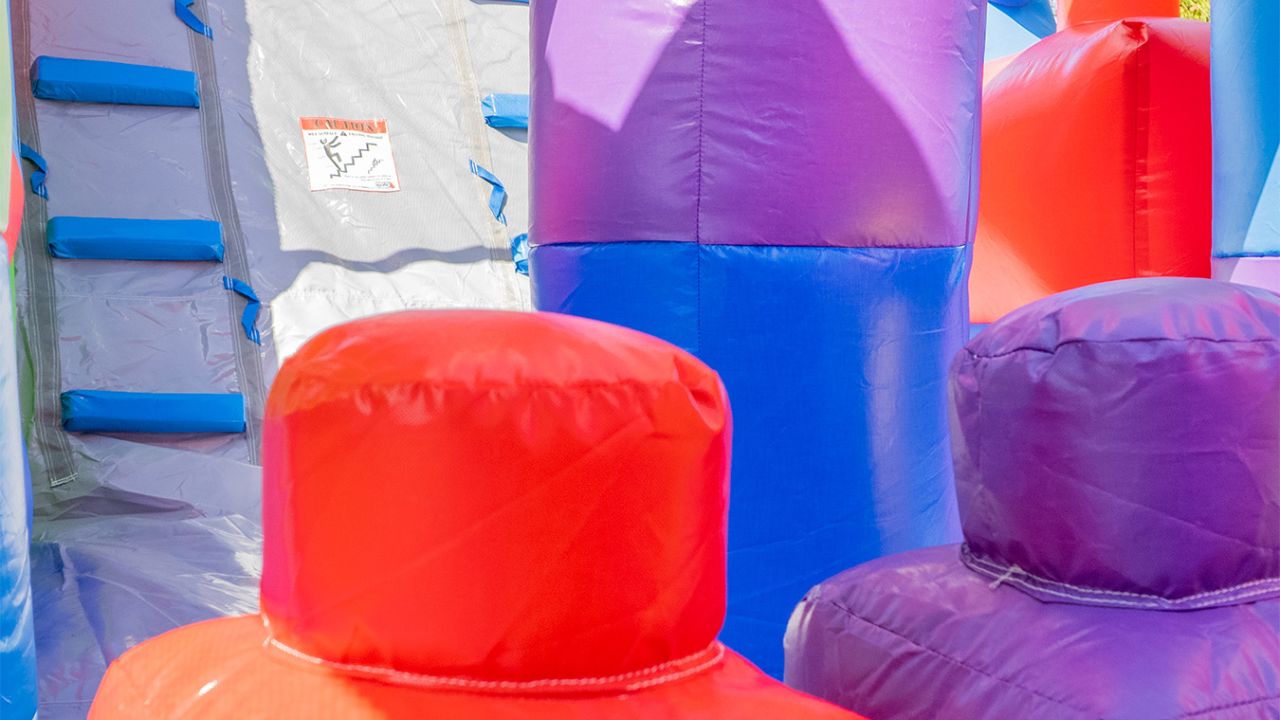 commercial grade bounce house with a slide